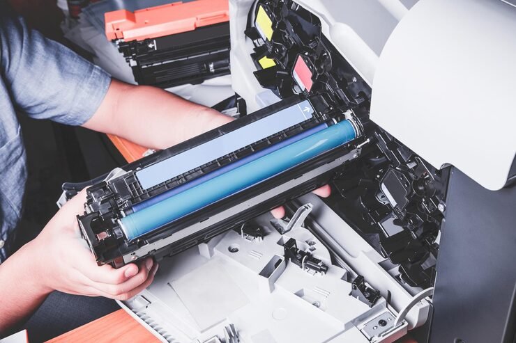 printer technicican checking printer toner